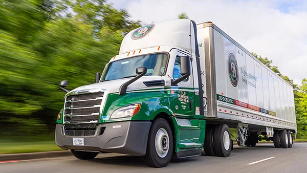 Truck_Driving_Road_Blur_600x338.jpg